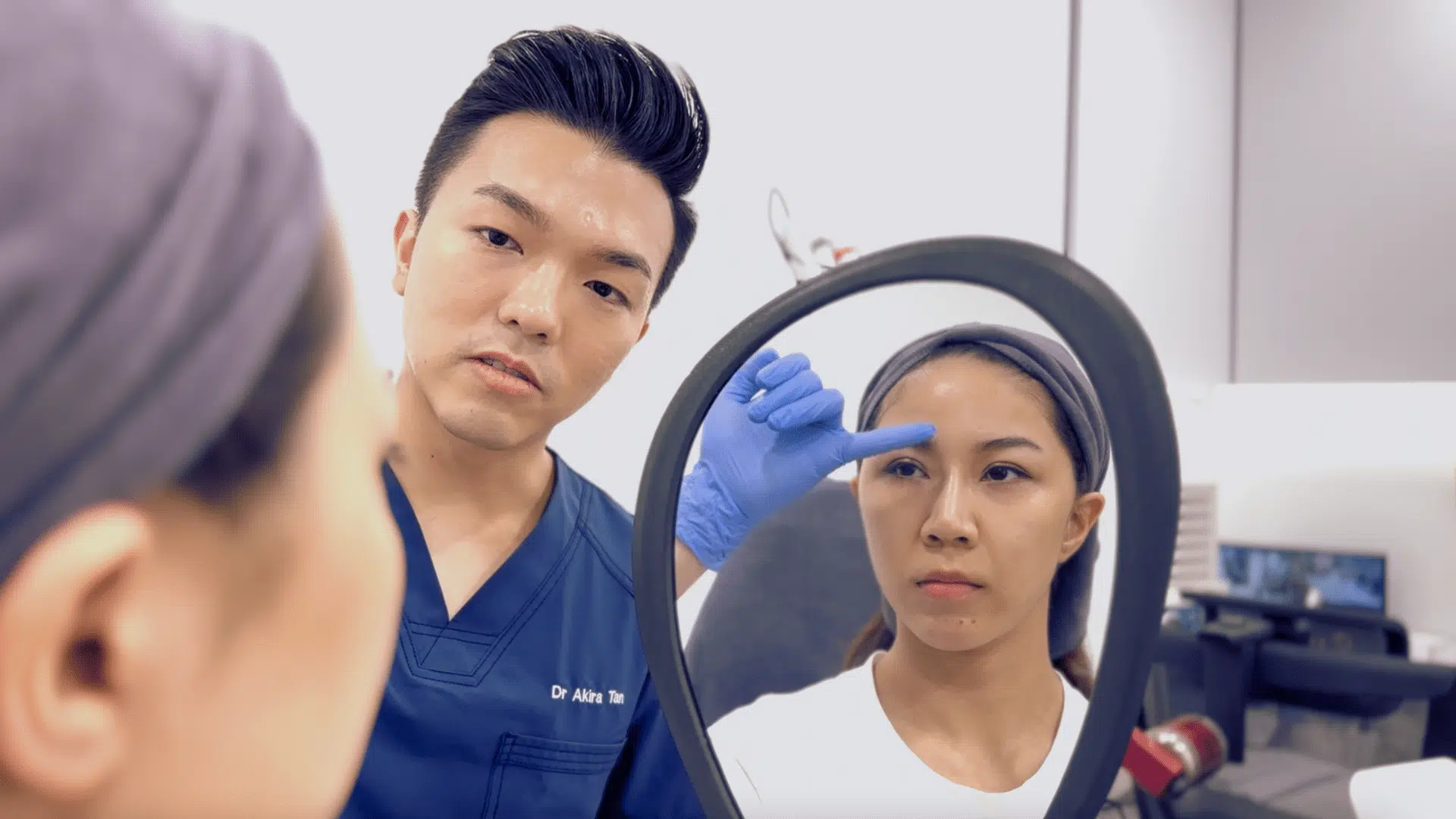 SL Aesthetic Clinic doctor assessing a patient's facial structure